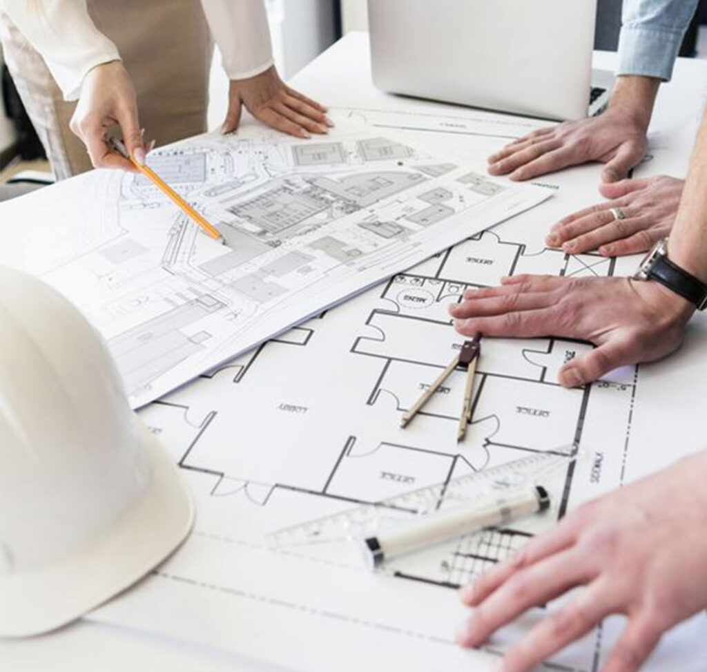 Flooring estimator reviewing an outsourced takeoff on two monitors